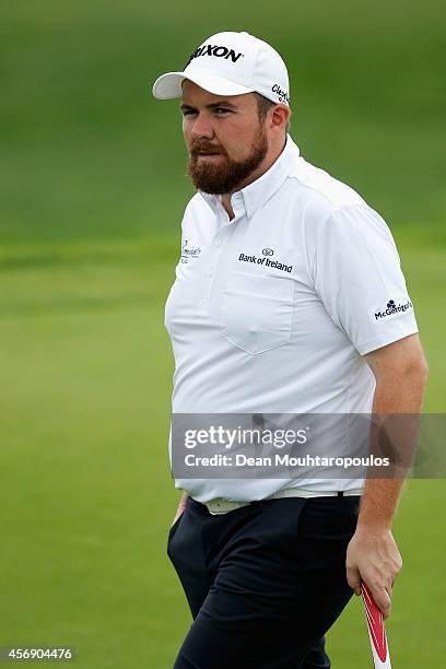 Shane Lowry of Ireland walks on the 2nd green during Day 1 of the Portugal Masters held at the Oceanico Victoria Golf Course on October 9, 2014 in...