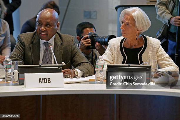 International Monetary Fund Managing Director Christine Lagarde looks on as African Development Bank Group President Donald Kaberuka delivers remarks...