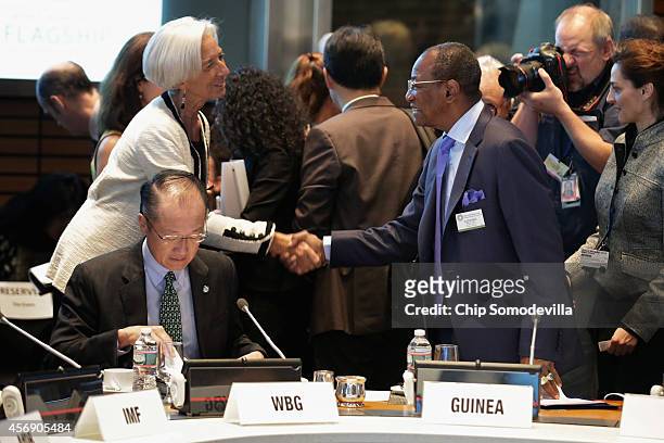 Guinea President Alpha Conde greets International Monetary Fund Managing Director Christine Lagarde with World Bank Group President Jim Yong Kim...