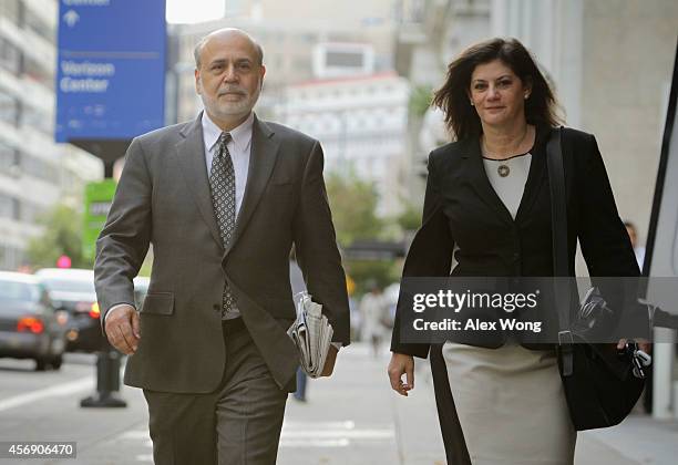 Former Chairman of the Federal Reserve Ben Bernanke arrives with an unidentified woman at U.S. Court of Federal Claims to testify at the AIG trial...