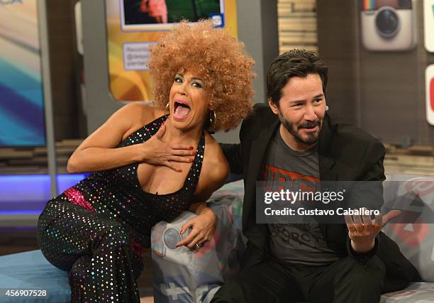 Karla Martinez and Keanu Reeves is on the set of Despierta America at Univision Headquarters on October 9, 2014 in Miami, Florida.