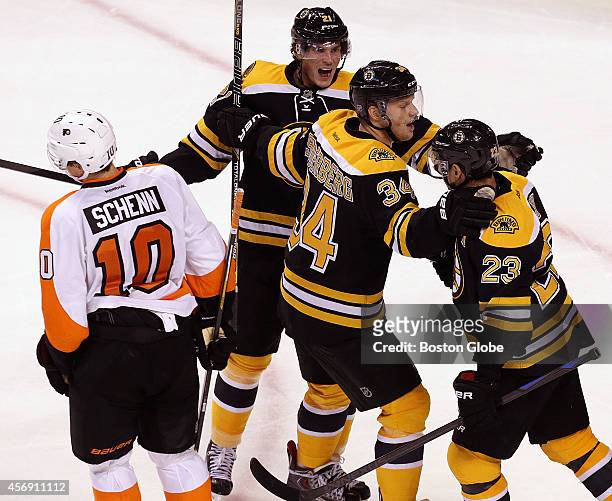 Boston Bruins center Chris Kelly is at the center of the celebration after scoring the game winning goal late in the third period. The Boston Bruins...