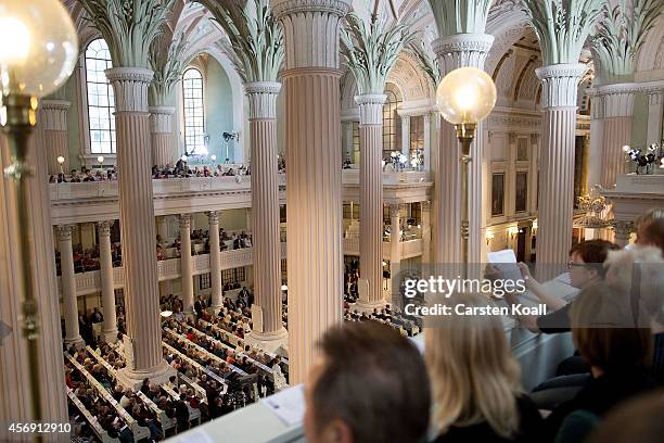 People attend mass in the Nikolaikirche church as part of commemorations marking the 25th anniversary of the mass protests in Leipzig that preceded...