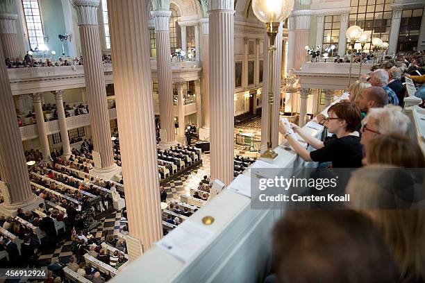 People attend mass in the Nikolaikirche church as part of commemorations marking the 25th anniversary of the mass protests in Leipzig that preceded...