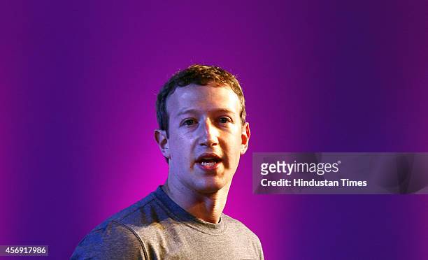 Co-founder and chief executive of Facebook Mark Zuckerberg gestures as he announces the Internet.org Innovation Challenge in India on October 9, 2014...