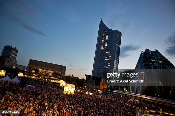 People gather on the Augustplatz square to tage part of commemorations marking the 25th anniversary of the mass protests in Leipzig that preceded the...