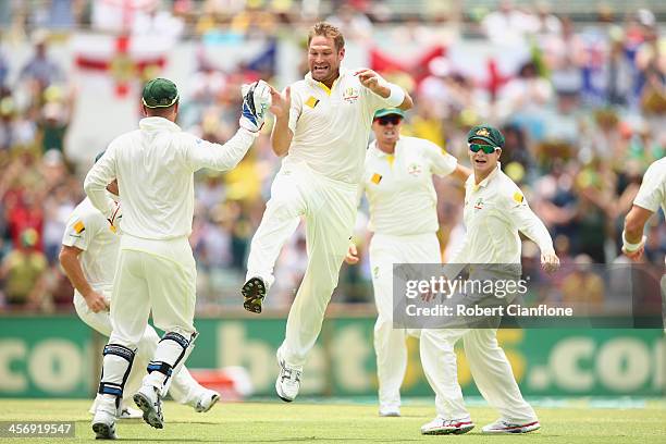 Ryan Harris of Australia celebrates after taking the wicket of Alastair Cook of England during day four of the Third Ashes Test Match between...