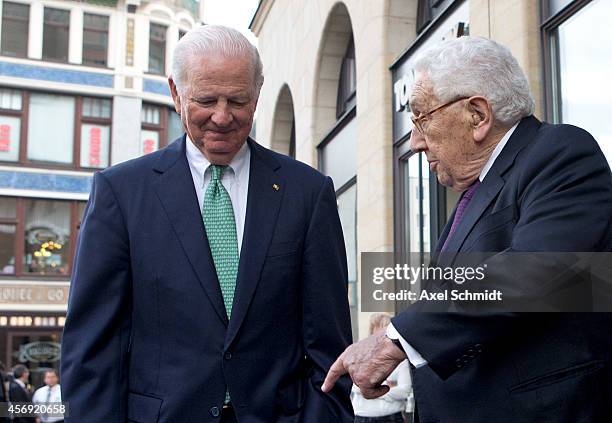 Henry Kissinger and Former U.S. Secretaries of State James Baker leaving a hotel after a press conference marking the 25th anniversary of the mass...