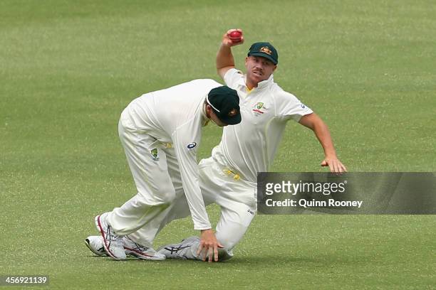 Steve Smith and David Warner of Australia collide whilst fielding during day four of the Third Ashes Test Match between Australia and England at WACA...