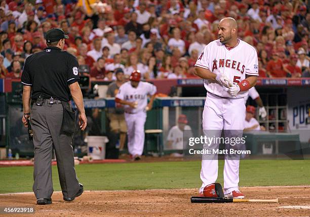 Albert Pujols of the Los Angeles Angels of Anaheim argues with an umpire after striking out against the Kansas City Royals during Game 2 of the...