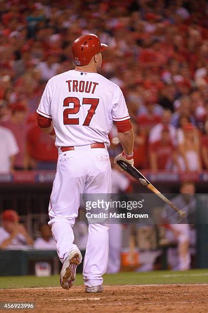 Mike Trout of the Los Angeles Angels of Anaheim walks towards the dugout against the Kansas City Royals during Game 2 of the American League Division...