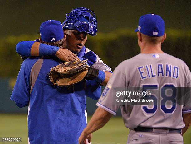 Salvador Perez of the Kansas City Royals hugs a teammate after the game against the Los Angeles Angels of Anaheim during Game 2 of the American...