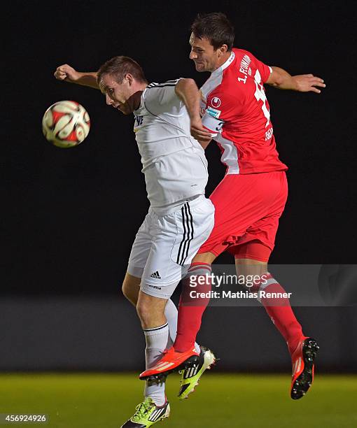 Tom Hagel of FC Strausberg and Mario Eggimann of 1 FC Union Berlin go up for a header during the friendly match between FC Strausberg and 1 FC Union...