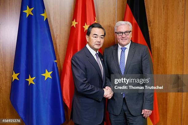 October 09: German Foreign Minister Frank-Walter Steinmeier meets with Foreign Minister of China, Wang Yi on October 09, 2014 in Berlin, Germany....