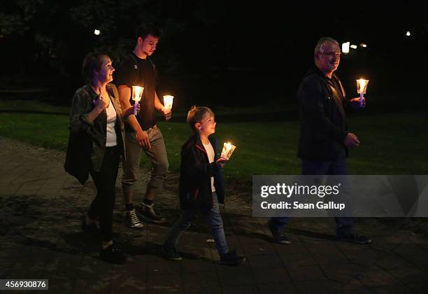 People, walking along the same route marched by 70,000 protesters demanding freedom 25 years before, commemorate the 25th anniversary of the mass...