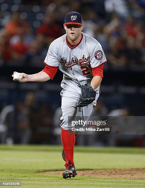 Pitcher Drew Storen of the Washington Nationals makes a play on a ground ball during the game against the Atlanta Braves at Turner Field on September...