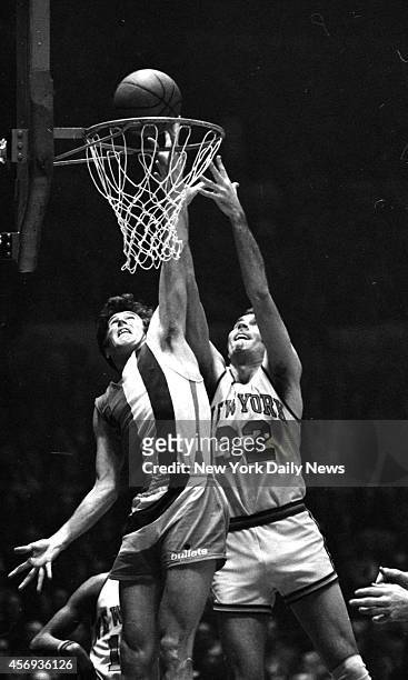 New York Knicks' Jerry Lucas and ex-Knick Mike Riordan of the Bullets battle for ball above the rim in third period of NBA opening round finale at...