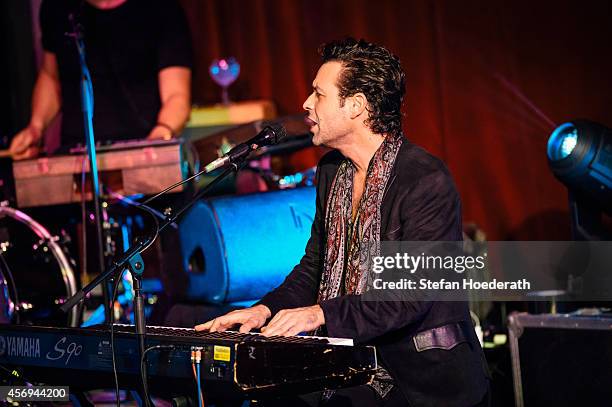 Canadian singer Adam Cohen performs live on stage during a concert at Tempodrom on October 9, 2014 in Berlin, Germany.