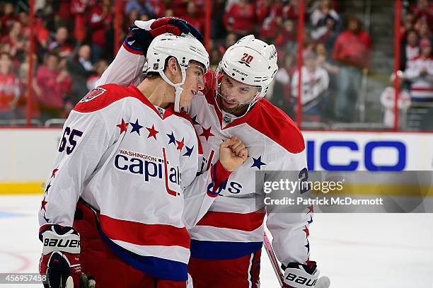 Andre Burakovsky of the Washington Capitals celebrates with Troy Brouwer after scoring his first career NHL goal in the first period against the...