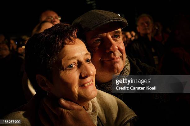 People stay on Augustplatz square during commemorations October 9, 2014 in Leipzig, Germany. The commemorations mark the 25th anniversary of the mass...