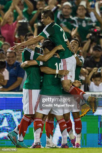 Javier Hernandez of Mexico celebrates with teammates after scoring during a friendly match between Mexico and Honduras at Victor Manuel Reyna Stadium...