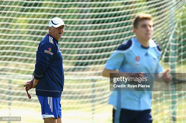 Graham Arnold, coach of Sydney FC, looks on during a Sydney Fc A-League training session at Macquarie Uni on October 10, 2014 in Sydney, Australia.