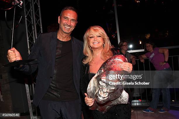 Juergen Reiter, KARE Founder and CEO and Bonnie Tyler attend the grand opening of KARE Kraftwerk on October 9, 2014 in Munich, Germany.