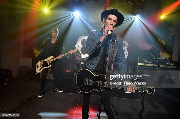 Duff McKagan and Jeff Angell of Walking Papers perform onstage at CBGB Music & Film Festival 2014 HQ Kickoff event with Keynote Speaker Billy Idol on...