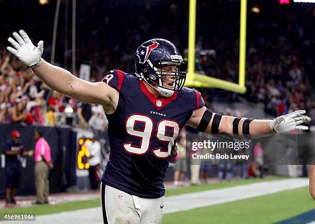 Watt of the Houston Texans celebrates an Indianapolis Colts fumble after he returned it for a touchdown in the fourth quarter in a NFL game on...