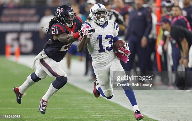 Hilton of the Indianapolis Colts is pushed out of bounds by Kendrick Lewis of the Houston Texans in the third quarter in a NFL game on October 9,...