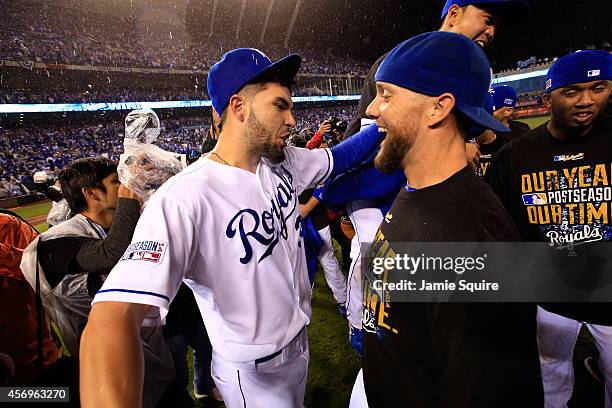 Eric Hosmer of the Kansas City Royals celebrates with Alex Gordon after the Royals defeated the Los Angeles Angels 8-3 to win game 3 of the American...