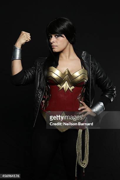Comic Con attendee Becca Noel poses as Wonder Woman during the 2014 New York Comic Con at Jacob Javitz Center on October 9, 2014 in New York City.