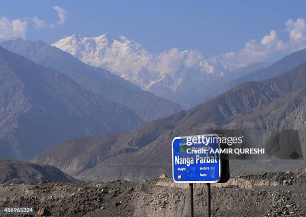 To go with story 'Pakistan-tourism-north' by Gohar ABBAS In this photograph taken on August 7, 2014 a sign points towards a view of Nanga Parbat ,...