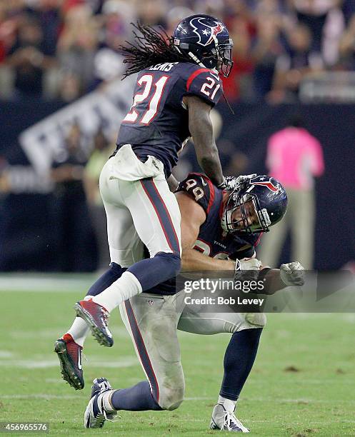 Watt and Kendrick Lewis of the Houston Texans celebrate against the Indianapolis Colts in the fourth quarter in a NFL game on October 9, 2014 at NRG...