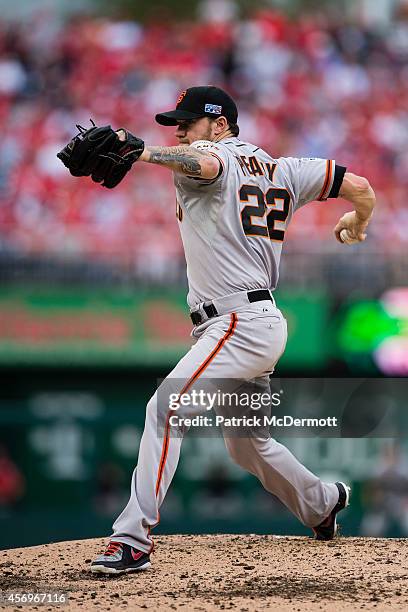 Jake Peavy of the San Francisco Giants pitches in the third inning against the Washington Nationals during Game One of the National League Division...