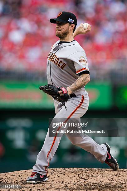 Jake Peavy of the San Francisco Giants pitches in the third inning against the Washington Nationals during Game One of the National League Division...