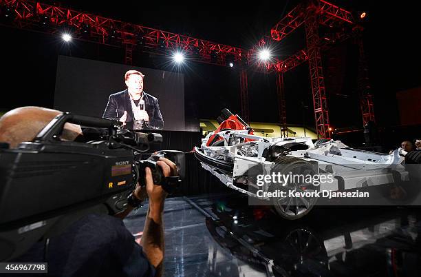 Elon Musk, CEO of Tesla, unveils the dual engine chassis of the new Tesla 'D' model at the Hawthorne Airport October 09, 2014 in Hawthorne,...