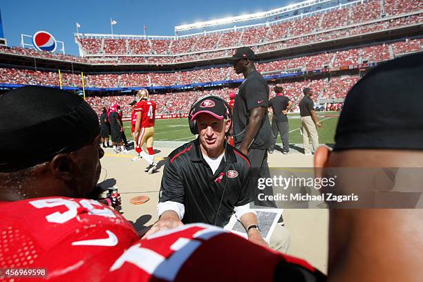 Linebackers Coach Jim Leavitt of the San Francisco 49ers talks with Patrick Willis during the game against the Kansas City Chiefs at Levi Stadium on...