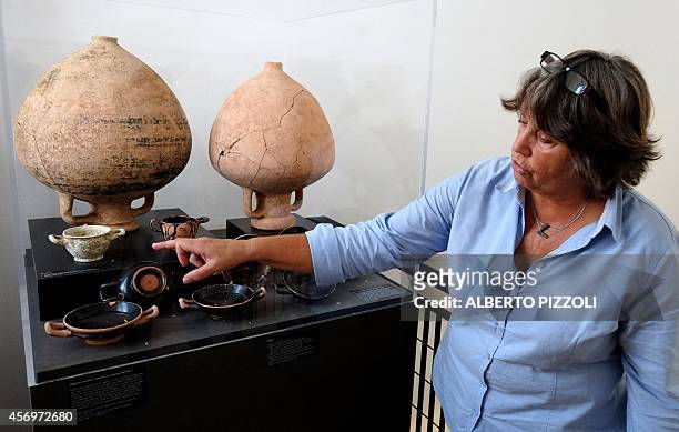Dutch archeologist Marijke Gnade, researcher in pre-Roman archeology at the University of Amsterdam, shows objects and amphora found in the vineyard...