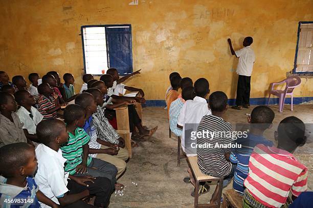 An elder Kenyan student lectures to the students in the classroom at an orphans' school in Garissa, 6 hours away to capital Nairobi, Kenya on October...