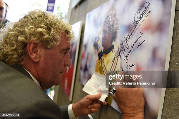 Jean-Marie Pfaff signs a picture after the Golden Foot Award press conference at Grimaldi Forum on October 10, 2014 in Monte-Carlo, Monaco.