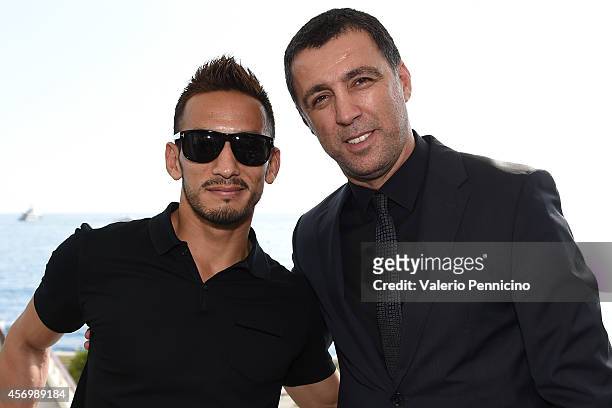 Hidetoshi Nakata and Hakan Sukur pose for a photo after the Golden Foot Award press conference at Grimaldi Forum on October 10, 2014 in Monte-Carlo,...