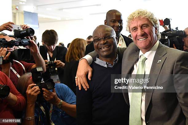 Roger Milla and Jean-Marie Pfaff pose for a photo after the Golden Foot Award press conference at Grimaldi Forum on October 10, 2014 in Monte-Carlo,...