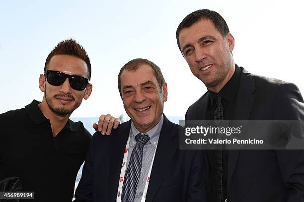 Hidetoshi Nakata , Antonio Caliendo and Hakan Sukur pose for a photo after the Golden Foot Award press conference at Grimaldi Forum on October 10,...