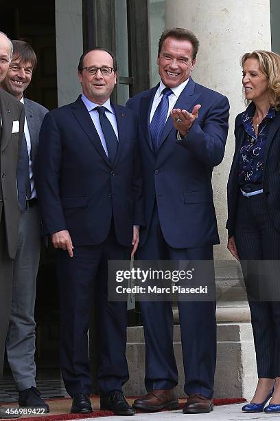 French President Francois Hollande receives Arnold Schwarzenegger at Elysee Palace on October 10, 2014 in Paris, France.