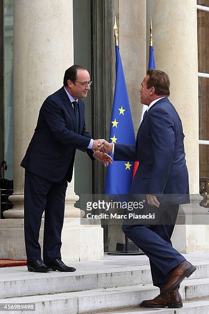 French President Francois Hollande receives Arnold Schwarzenegger at Elysee Palace on October 10, 2014 in Paris, France.