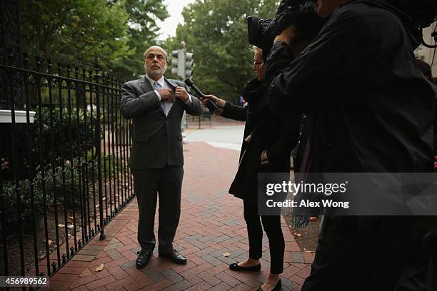 Former Chairman of the Federal Reserve Ben Bernanke is approached by a member of the media as he arrives at U.S. Court of Federal Claims to testify...
