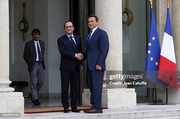 French President Francois Hollande receives Arnold Schwarzenegger to talk about climate change at Elysee Palace on October 10, 2014 in Paris, France.