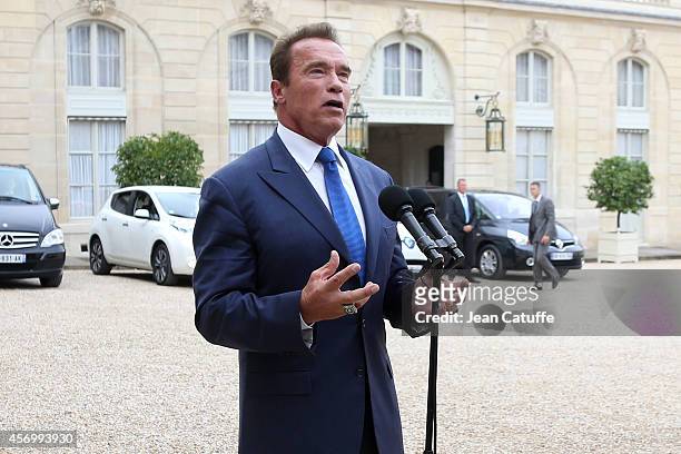 French President Francois Hollande receives Arnold Schwarzenegger to talk about climate change at Elysee Palace on October 10, 2014 in Paris, France.