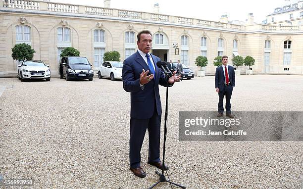 French President Francois Hollande receives Arnold Schwarzenegger to talk about climate change at Elysee Palace on October 10, 2014 in Paris, France.